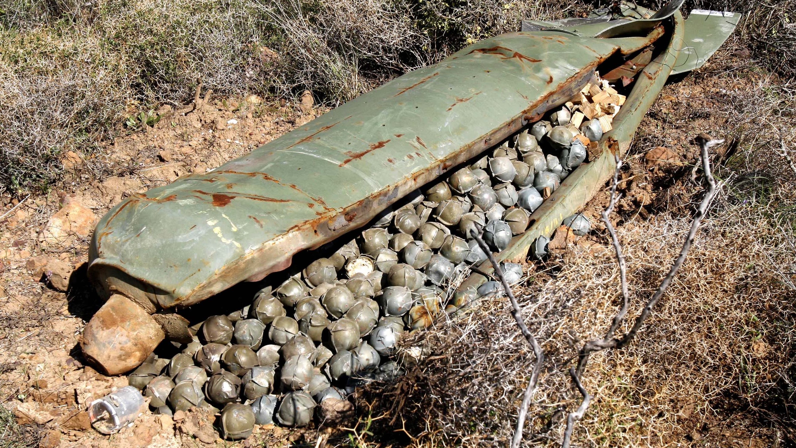 A cluster bomb unit containing more than 600 submunitions, that was dropped by Israeli warplanes during the 34-day long Hezbollah-Israeli war, sits in a field in the southern village of Ouazaiyeh, Lebanon, Thursday, 9 November 2006