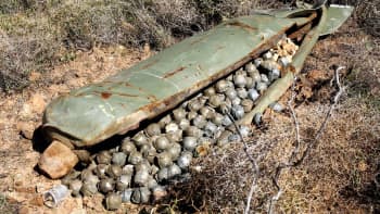 A cluster bomb unit containing more than 600 submunitions, that was dropped by Israeli warplanes during the 34-day long Hezbollah-Israeli war, sits in a field in the southern village of Ouazaiyeh, Lebanon, Thursday, 9 November 2006