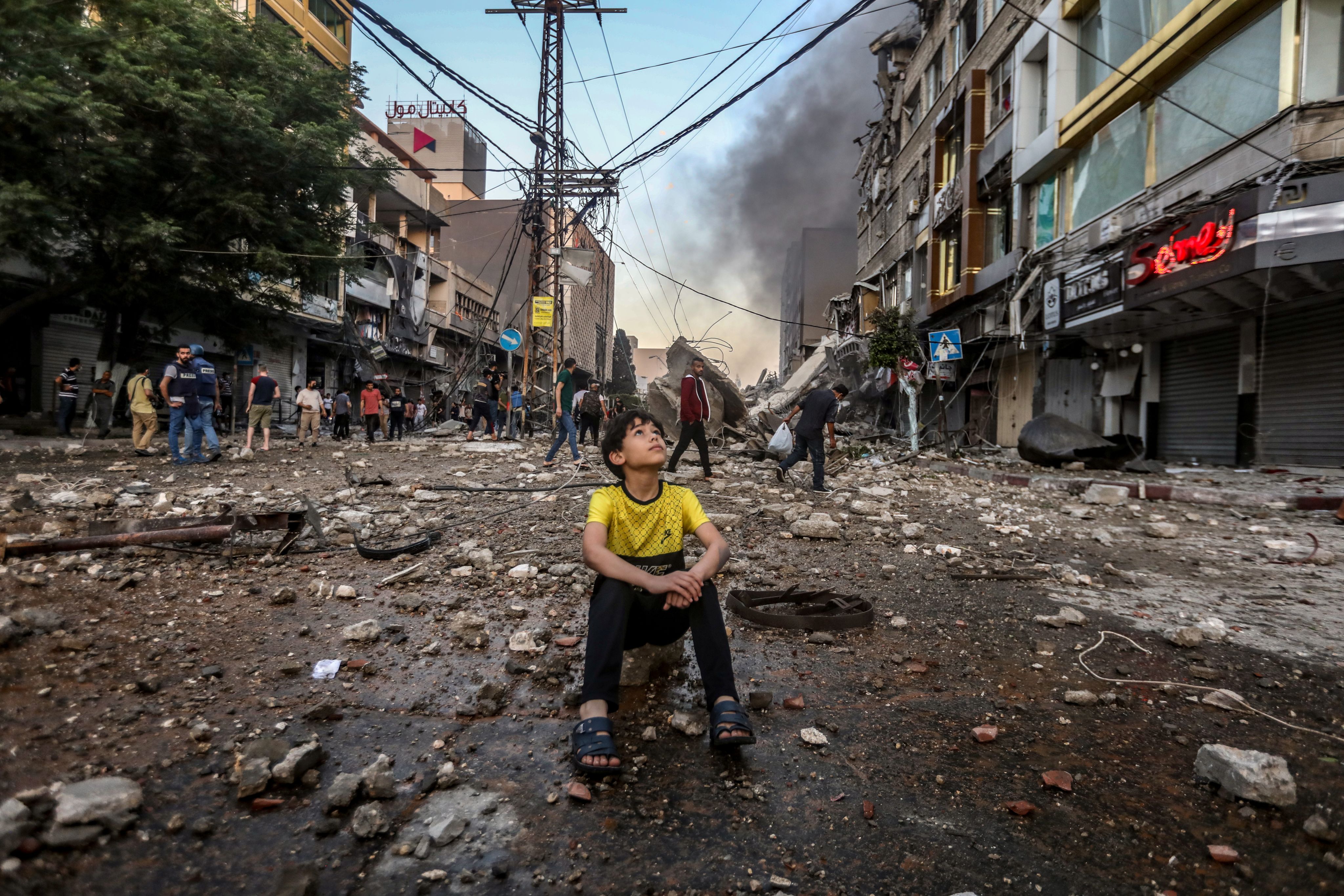A boy in a bombed out street in Gaza during Israel's bombardment in May 2021.