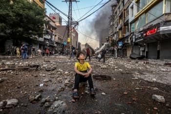 A boy in a bombed out street in Gaza during Israel's bombardment in May 2021.